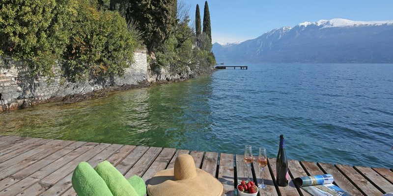 Lake Garda family villa directly on the lake with stunning views and private swimming dock
